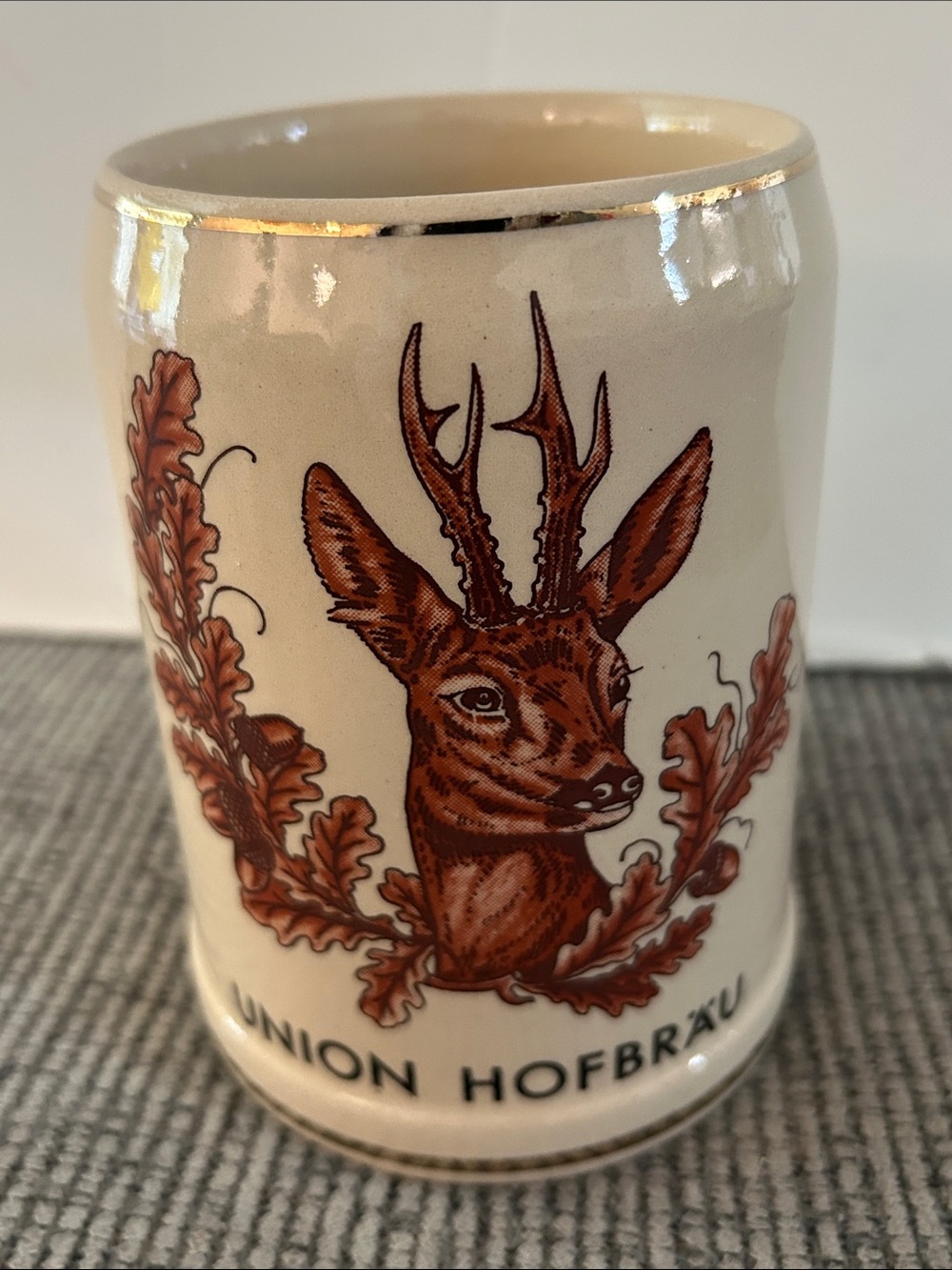 vintage German stoneware beer mug 0.5L featuring deer stag leaves Union Hofbräu